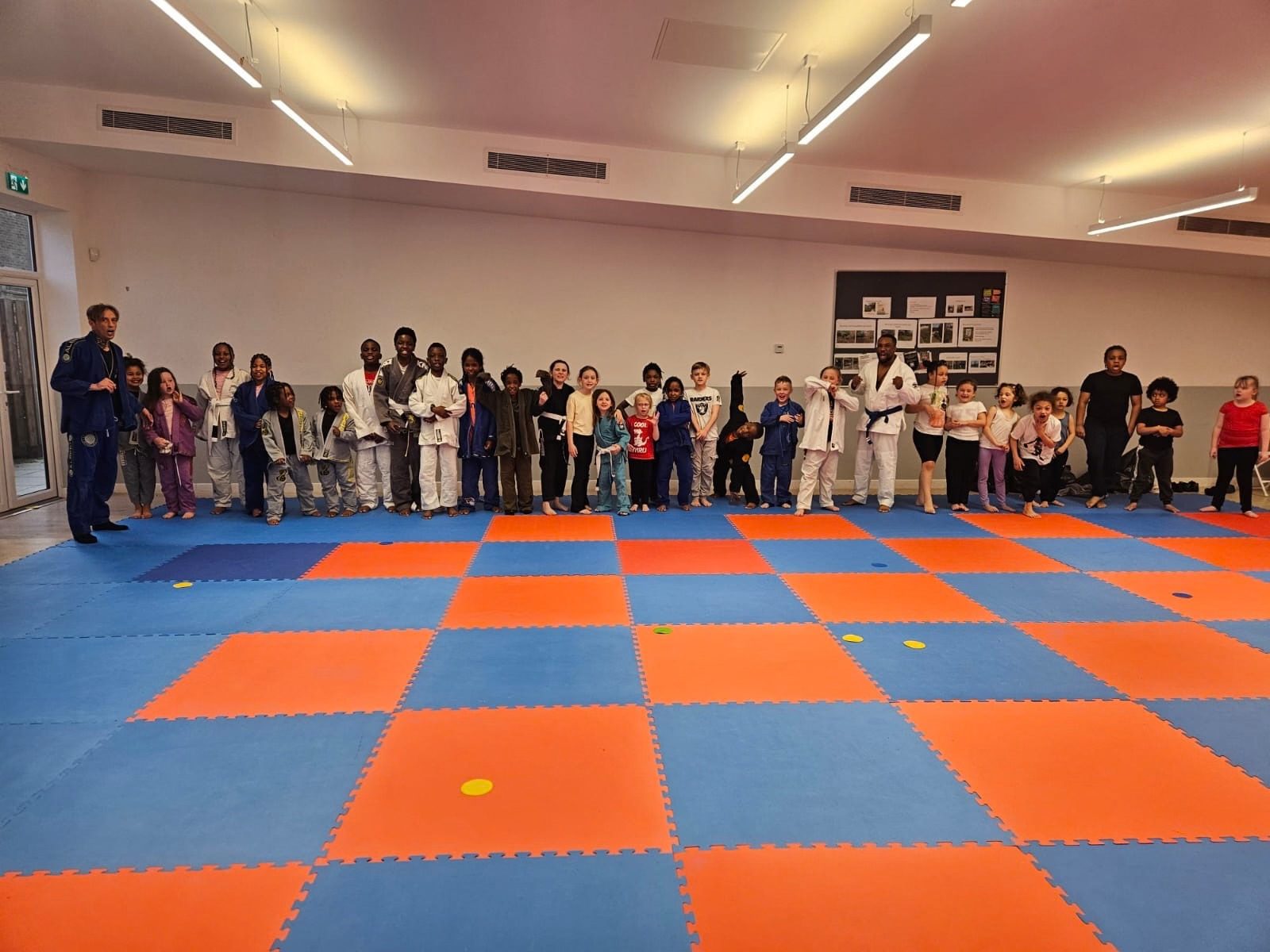 Children lined up in the sports hall at Woolwich Common Community Centre